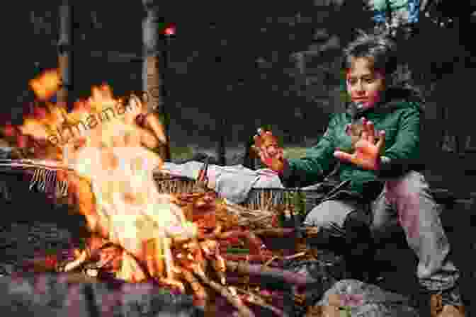 A Boy Lost In The Wilderness, Sitting By A Campfire For Warmth And Comfort The Boy Who Was Lost