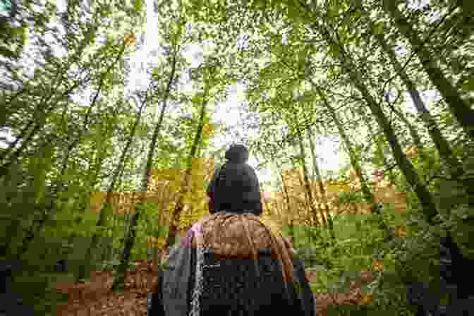 Walking Through A Vibrant Forest, A Woman's Silhouette Emerges, Symbolizing The Path To Spiritual Freedom. The Spiritual Meaning Of Freedom